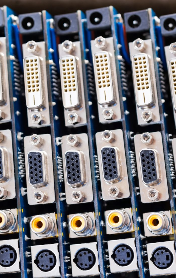 Close-up blurry metal sockets on a computer video board. Concept for the production of computer televisions and audio speakers